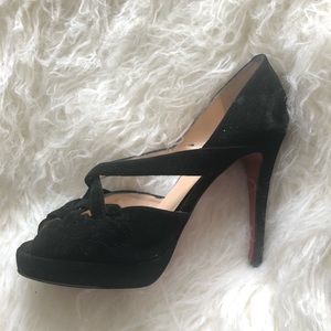 Iconic black suede Christian Louboutin pumps